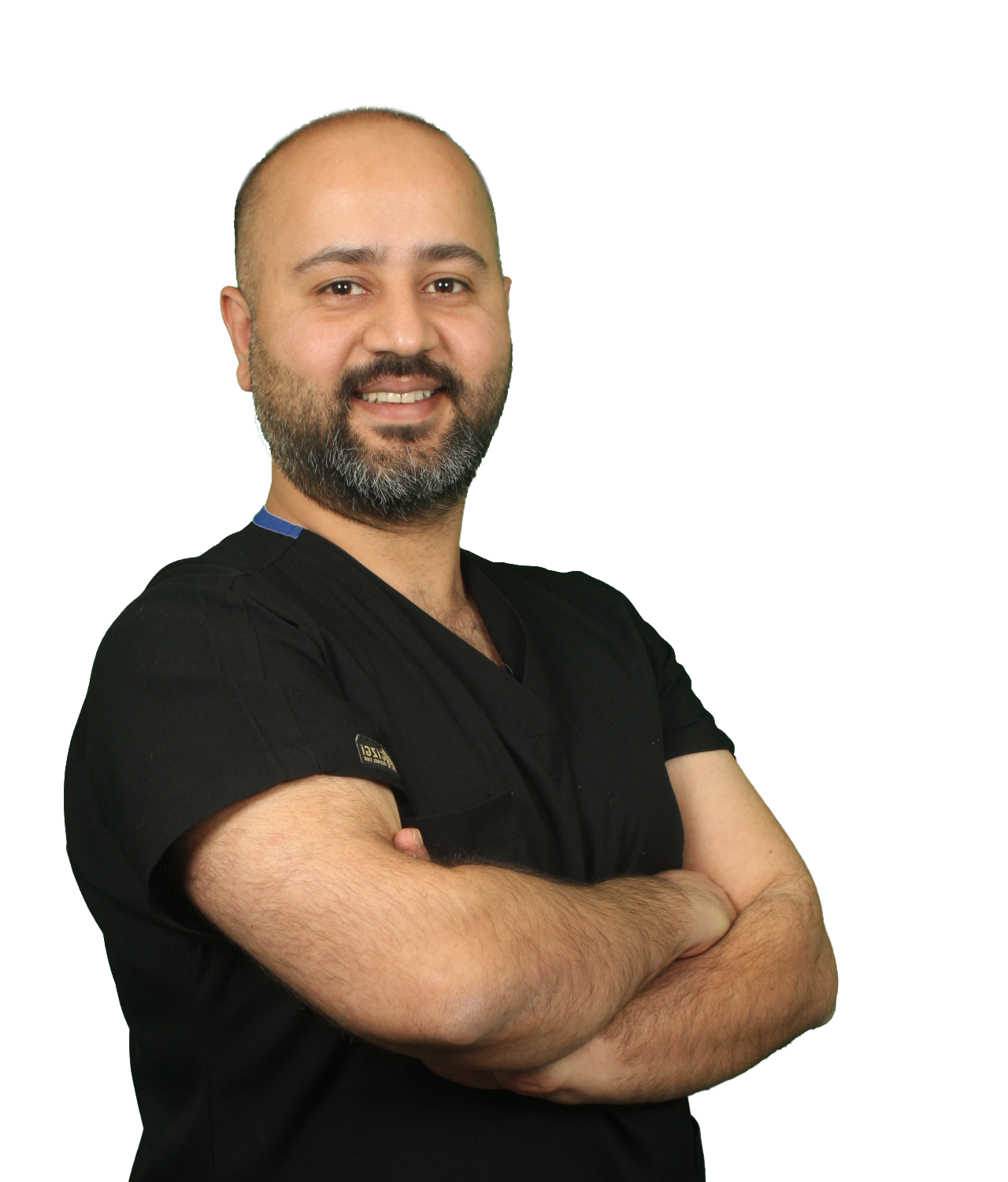 Dr. Burhan Akyüz, senior dentist at Pataradent, wearing professional dental attire with a friendly expression against a neutral background